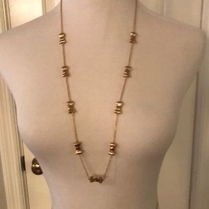 NWT Kate Spade gold take a bow long necklace.